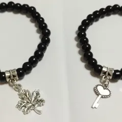 Pulso de perlas negras con dije plateado. p27 y p29N — imagen 1