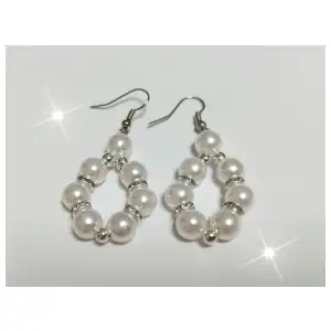 Aretes con perlas en círculo. miniatura 1
